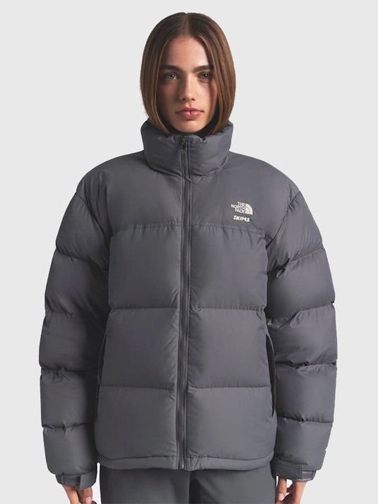Recreated 2025 drop The North Face × SKIMS grey Nuptse puffer jacket featuring parachute shell and classic puffer design.