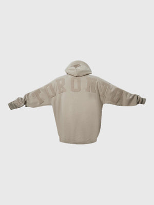 Toronto Blue Jays light brown pullover hoodie with Wingspan logo and relaxed drop shoulder style.