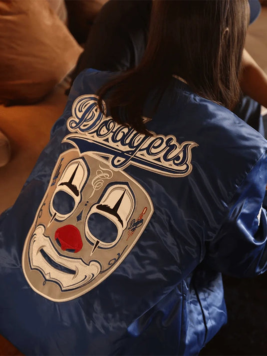 Dodgers x Mister Cartoon Blue Satin Recreation Jacket featuring smooth satin texture and iconic collaborative detailing.