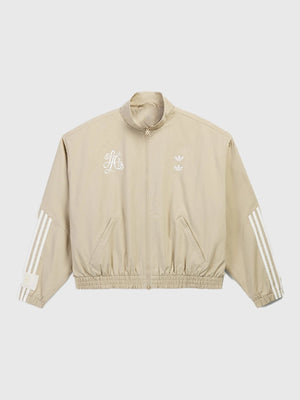 Recreated Adidas x Willy Chavarria Compton Cowboys unisex track jacket in chino beige with embroidered co-branding and relaxed fit