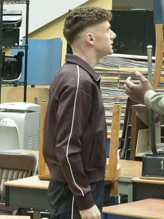 Chris Perfetti Jacob Hill track jacket in brown from Abbott Elementary 2026, featuring a streamlined sporty silhouette
