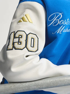 Recreated blue and white Adidas Boston Marathon 26 varsity jacket combining warm wool fabric with timeless collegiate appeal