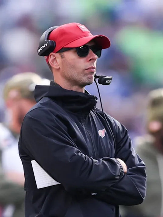 Coach Jonathan Gannon Arizona Cardinals black fleece half-zip hooded jacket for 2025 NFL game day.