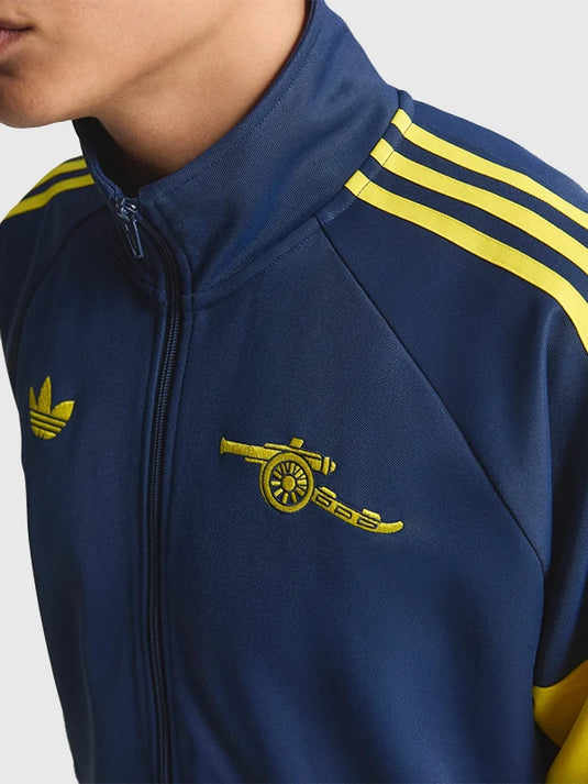 Adidas Arsenal FC LFSTLR Track Jacket in navy recreated with signature stripes and soft fabric.