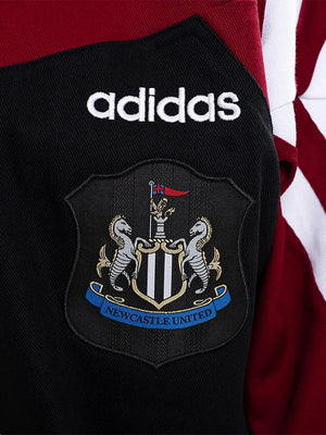 RECREATED Newcastle United Adidas drill top featuring vintage football aesthetics and casual fit