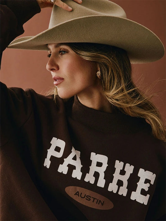 Recreated Austin Signature sweatshirt in brown crafted from soft fleece with a tailored mockneck.