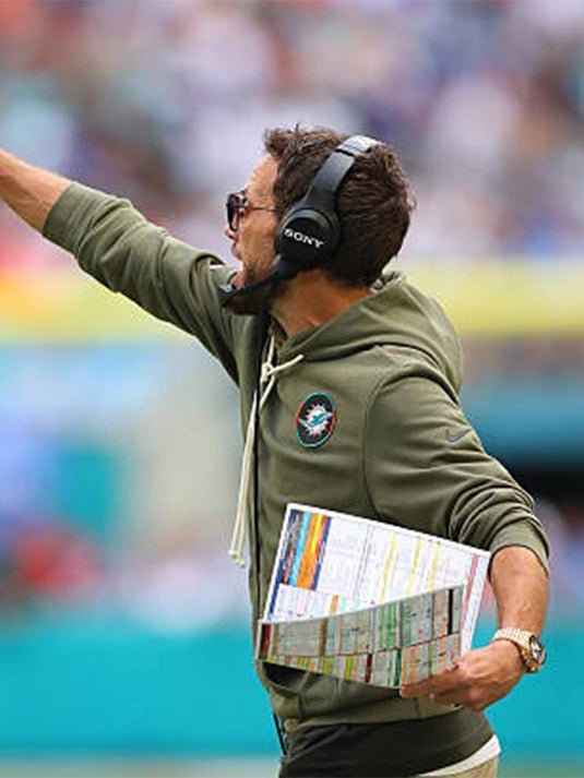 2025 Miami Dolphins Salute to Service olive green hoodie reflecting Coach Mike McDaniel’s clean sideline design.