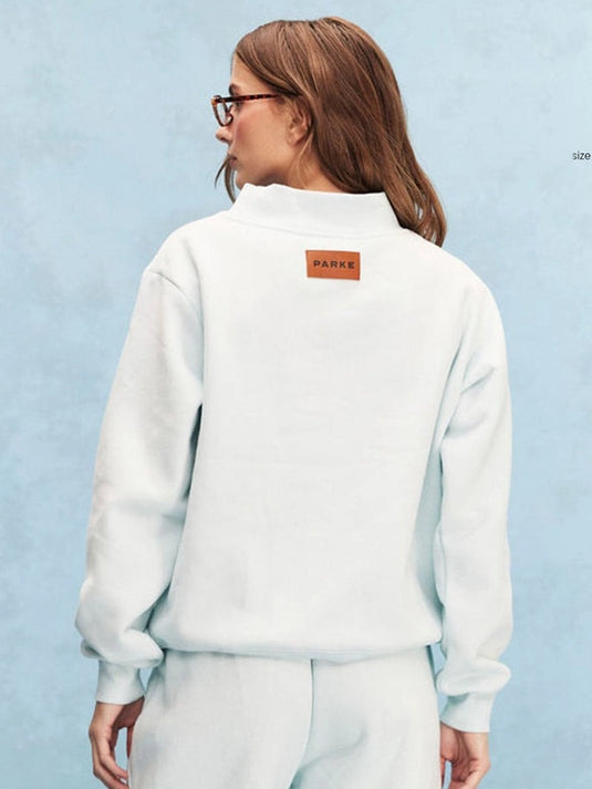 Tonal light blue mockneck fleece sweatshirt from Parke 2026 with an elevated, cozy silhouette