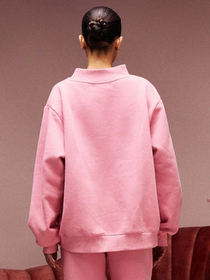Pink RECREATED Women’s Parke Jean Heart 2026 varsity sweatshirt designed with cozy fleece and a structured fit