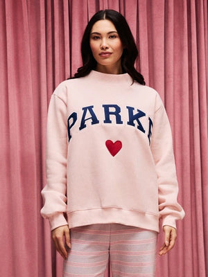 RECREATED Parke Valentine’s 2026 pink fleece sweatshirt designed with varsity-inspired detailing and mockneck collar