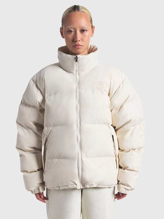 Recreated The North Face × SKIMS 1996 Nuptse parachute puffer jacket in off-white with soft insulation and classic boxy silhouette.