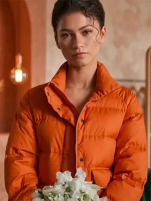 Recreated unisex Zendaya The Drama 2026 Emma Harwood parachute puffer jacket in orange with bold design and lightweight insulation