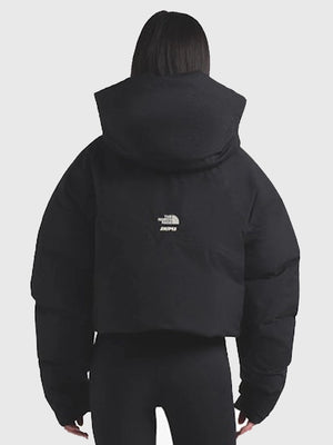 The North Face x SKIMS women’s 2025 puffer jacket recreation showcasing a bold black and off-white color contrast