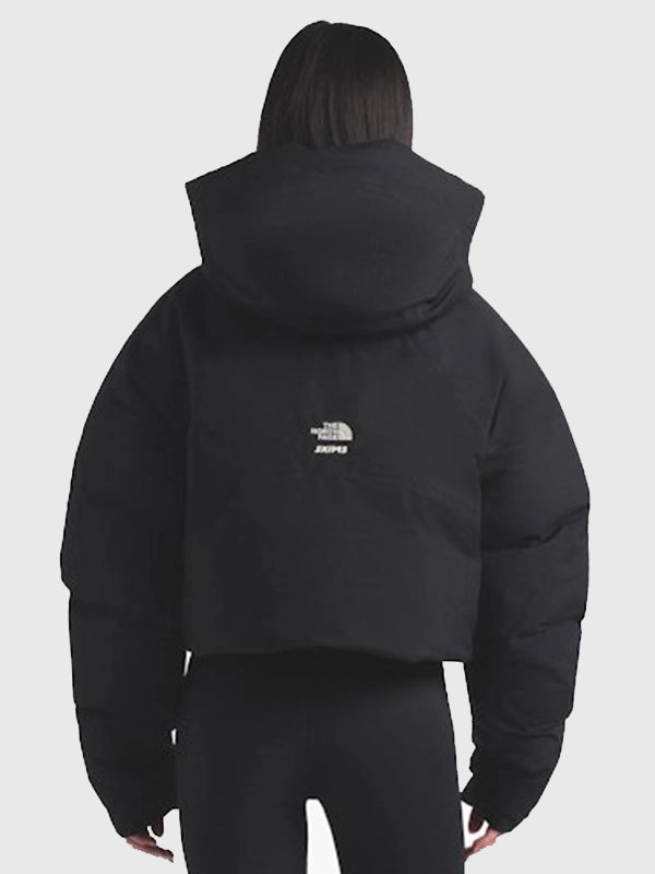 The North Face x SKIMS women’s 2025 puffer jacket recreation showcasing a bold black and off-white color contrast