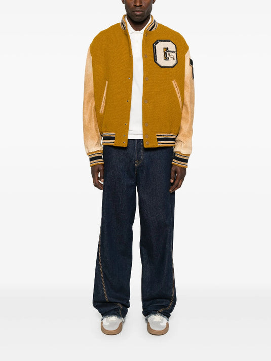 Mustard varsity jacket inspired by Noah Schnapp’s Season 5 Stranger Things promo outfit.