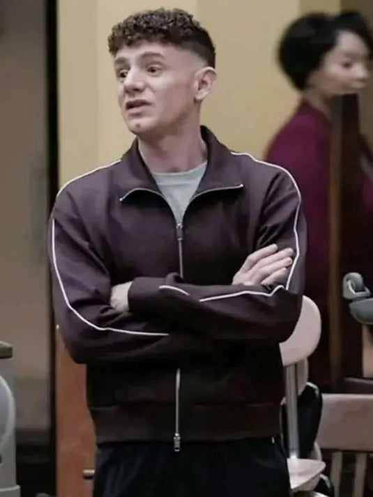 Chris Perfetti Abbott Elementary S05 Jacob Hill track jacket in brown, 2026 design with sleek sporty styling