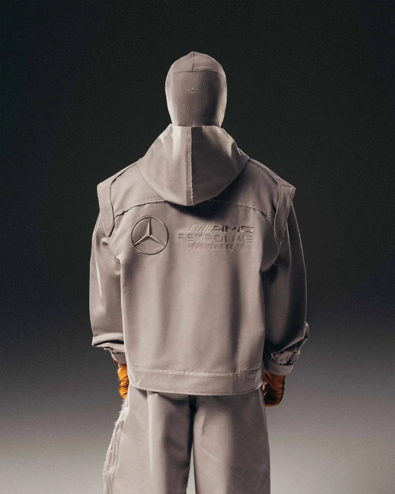 Black full-zip hoodie from Adidas x Bad Bunny x Mercedes featuring balaclava-style hood and signature racing stripe accents