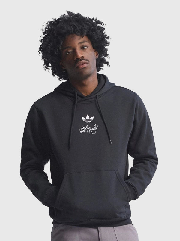 Black fleece pullover hoodie recreated from the Adidas x Bob Marley 2026 Football Is Freedom collection with bold cultural graphics and soft fleece construction.