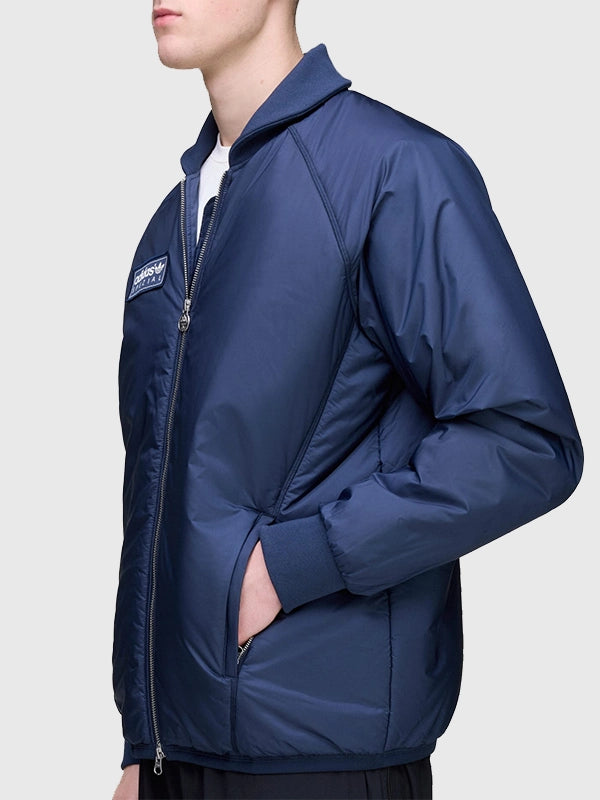 2025 Adidas Bramhope Spzl Blousson bomber jacket in blue with a lightweight build and signature Adidas detailing.