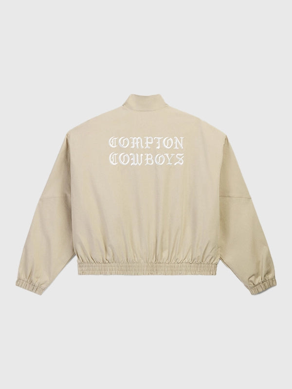 Unisex Adidas x Willy Chavarria Compton Cowboys beige track jacket featuring zip-front closure and signature three-stripe detailing