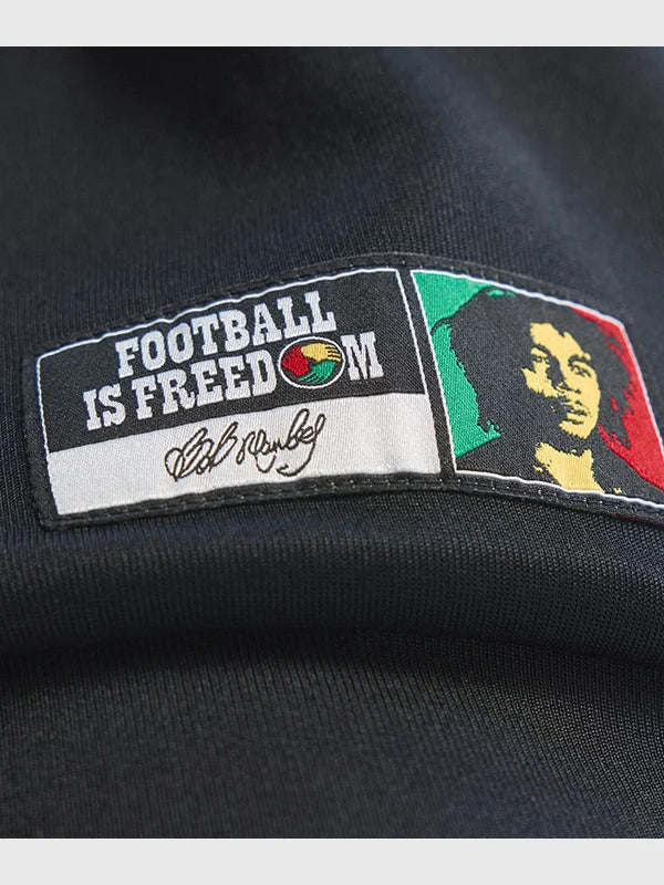 Recreated black full-zip track jacket from Adidas Jamaica x Bob Marley 2026 collection with sleek sport styling