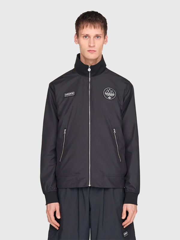 Adidas Hudswell Hooded Jacket featuring smooth finish, refined stitching, and versatile everyday layering fit