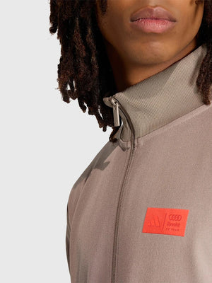 Recreated Adidas x Audi Revolut F1 Team Elevated brown full-zip jacket combining performance-inspired design and everyday wearability