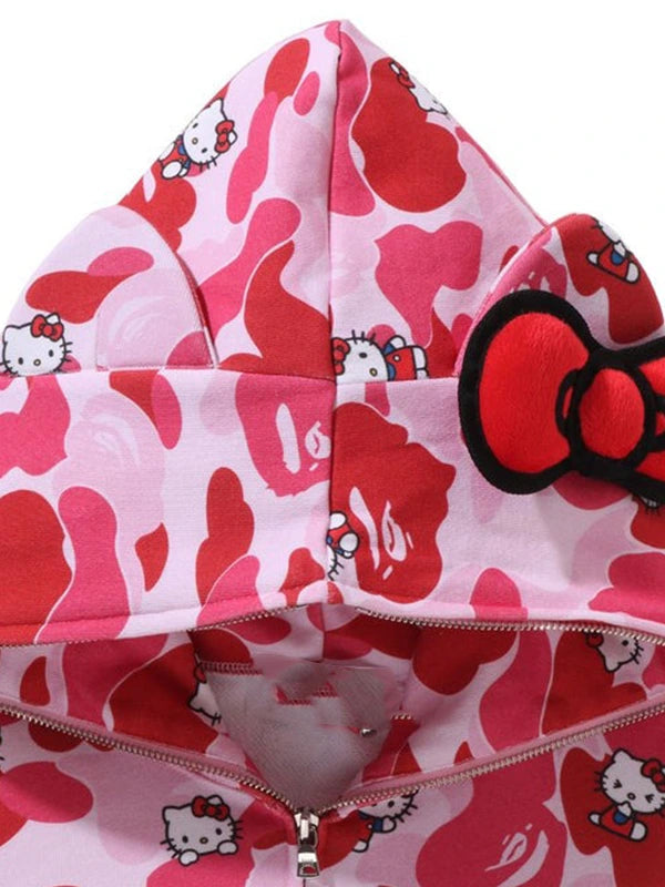 Recreated pink camo Hello Kitty fleece hoodie with structured hood and classic street-inspired silhouette