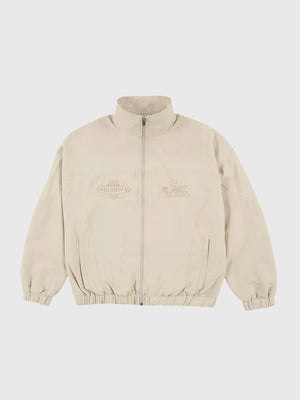 Off-white Bad Bunny x Super Tazón LX full-zip track jacket featuring monochromatic NFL-inspired designs and elastic cuffs