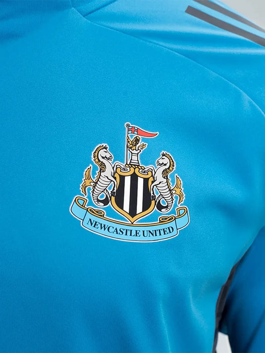 Newcastle United FC 2025/26 Players Range blue performance T-shirt by adidas featuring a clean quarter-zip front.