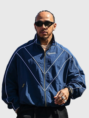 Lewis Hamilton 2026 Willy Chavarria track jacket in blue combining smooth fabric and contemporary sport-inspired style