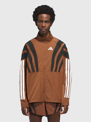 RECREATED Adidas x Pharrell Williams Humanrace 2026 Brown Adizero Archive Running Jacket designed with streamlined running-inspired styling and modern sporty appeal