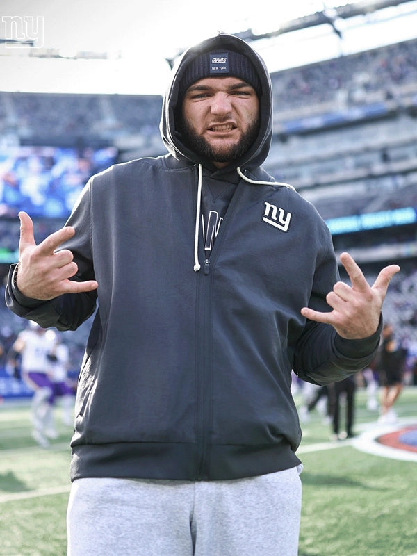 Black Minnesota Vikings sideline bomber jacket recreation featuring Cam Skattebo and Nike design details