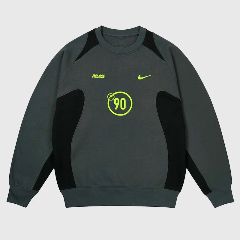 Palace x Nike 2025 Total P90 Crew Sweatshirt in charcoal grey fleece with clean branding and athletic edge.