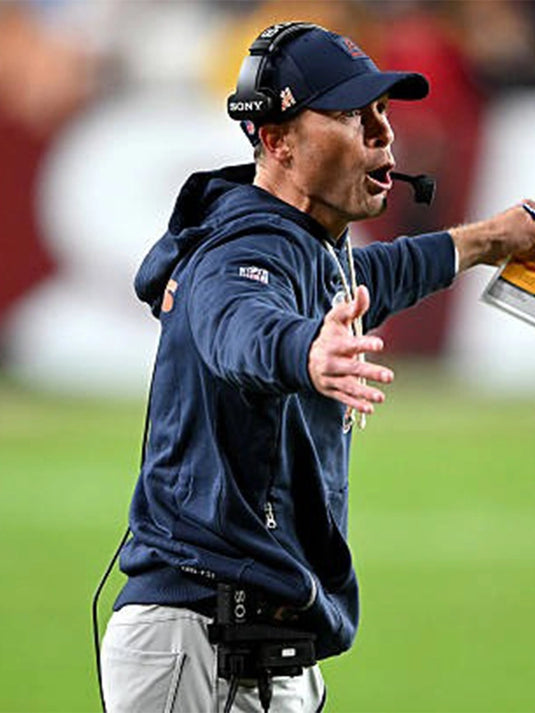 Navy Chicago Bears 2025 Nike Sideline Pullover Hoodie modeled after Ben Johnson’s on-field sideline wear.