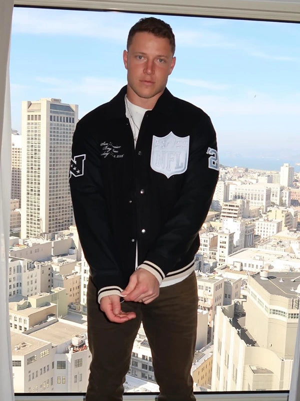 Black varsity jacket inspired by Christian McCaffrey’s 2026 Pro Bowl Games appearance, recreated with wool construction and leather sleeve detailing.