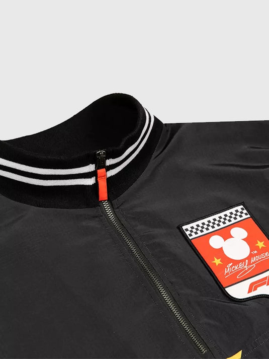 Disney x Formula 1 Recreation black windbreaker featuring elastic cuffs and functional side pockets.