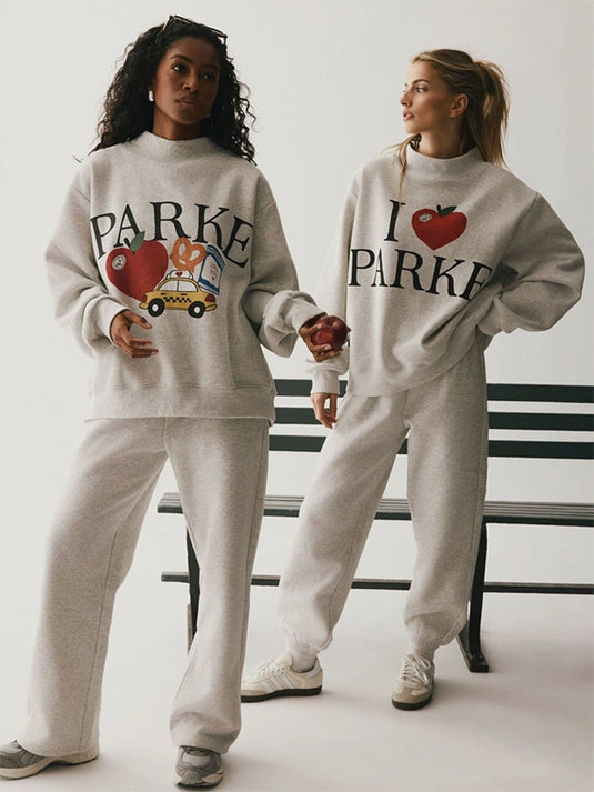 Recreated Parke New York Graphic Mockneck Fleece Sweatshirt in grey featuring bold city-inspired artwork.