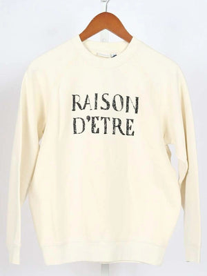 Christa Miller RECREATED Shrinking S03 cream fleece sweatshirt featuring Raison D’Etre text design