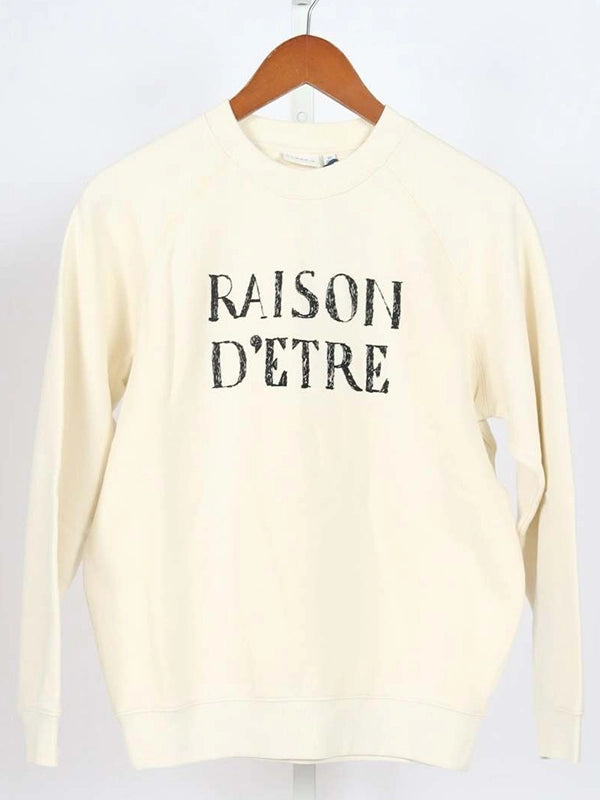 Christa Miller RECREATED Shrinking S03 cream fleece sweatshirt featuring Raison D’Etre text design
