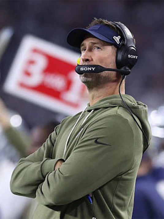Brian Schottenheimer Cowboys 2025 Hoodie crafted in olive green fleece with ribbed cuffs and drawstring hood.