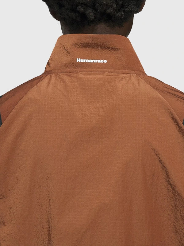 RECREATED Adidas x Pharrell Williams Adizero Archive Humanrace 2026 Brown Jacket featuring a sleek silhouette with modern sportswear aesthetics