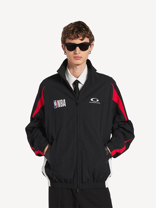 Black full zip track jacket from NBA x Balenciaga 2026 featuring a clean silhouette and modern unisex fit