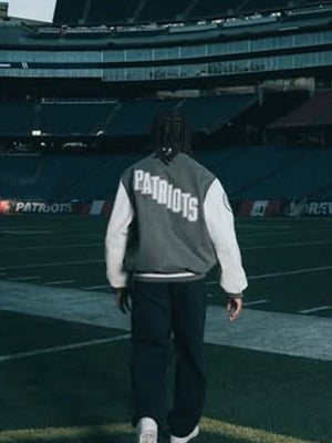 Recreated Patriots Rivalries wool varsity jacket featuring CNCPTS and Nike detailing in a sharp grey-white finish.