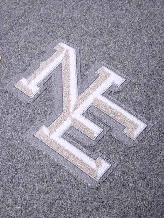 Recreated 2025 Patriots Rivalries jacket crafted with a premium wool build and contrasting grey-white panels.