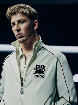 RECREATED Hugo x Red Bull 2026 Bull Motif Full Zip Track Jacket in White featuring a sleek athletic design with signature bull graphic and smooth track fabric
