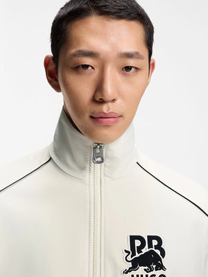 RECREATED Hugo x Red Bull 2026 Bull Motif White Track Jacket with lightweight track construction and clean performance driven aesthetics