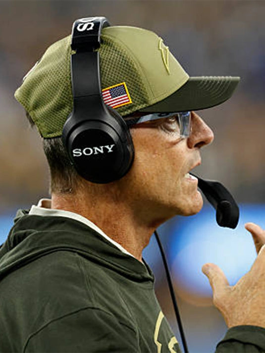 Lightweight forest green Salute to Service hooded pullover T-shirt worn by Jim Harbaugh for the Los Angeles Chargers.