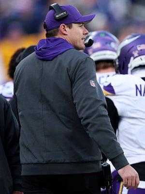 Black Minnesota Vikings sideline bomber jacket recreation associated with coach Kevin O’Connell and Nike styling