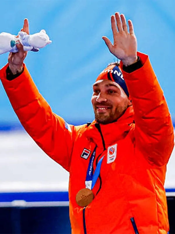 Kjeld Nuis Milano Cortina 2026 Team Netherlands puffer jacket in vibrant orange with lightweight warmth and durable outer shell